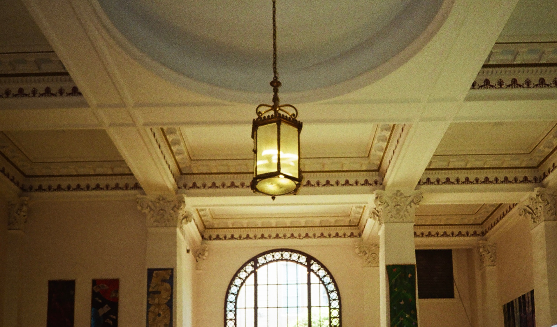 Coffered dome ceiling with a hanging lantern in a heritage interior